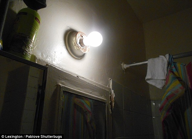 Good idea: Lexington, age 6, snooped inside a closet to take this picture of a single lightbulb on a white painted wall