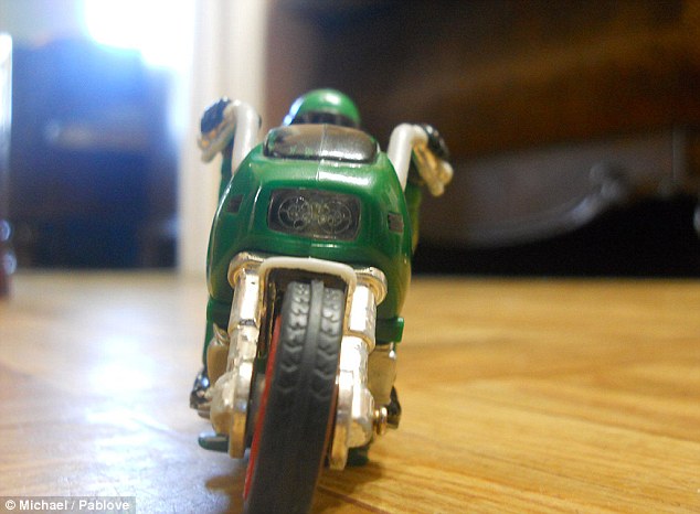 Free-wheeling: Michael, age 13 from New York, made use of a motorbike toy top create this optical illusion