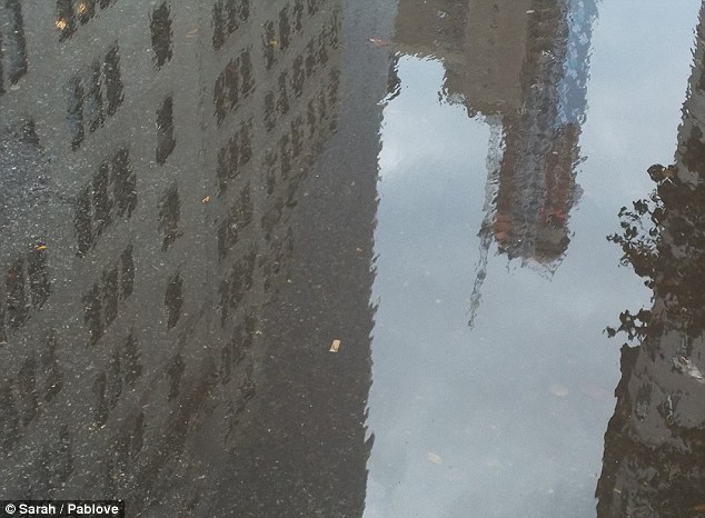 Heavy weather: Sarah, age 13, also made use of a puddle to show an alternative view New York