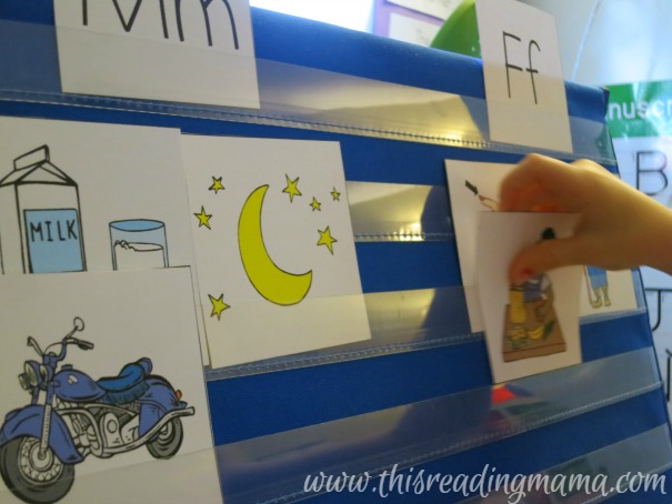 sorting pictures by beginning sound on pocket chart