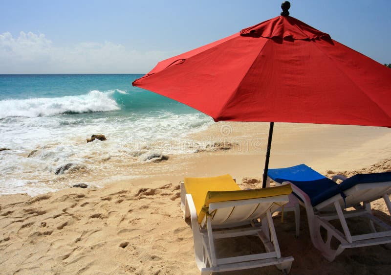 Beach Umbrella, St. Maarten. A couple of chairs and a big umbrella just for you, Maho Bay, St. Maarten stock photography